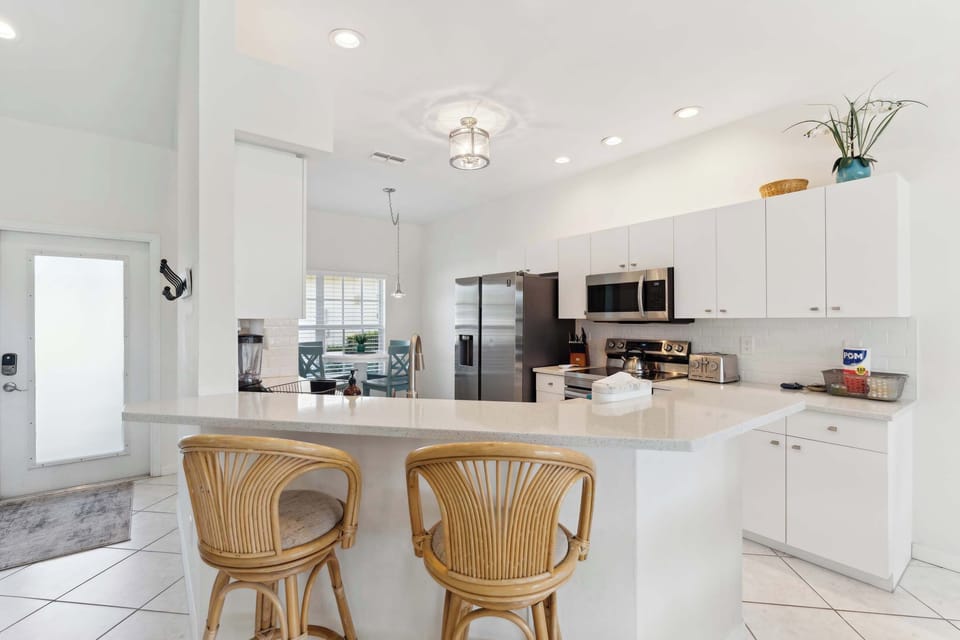 The kitchen also has 2 bar stools for informal dining at the counter 