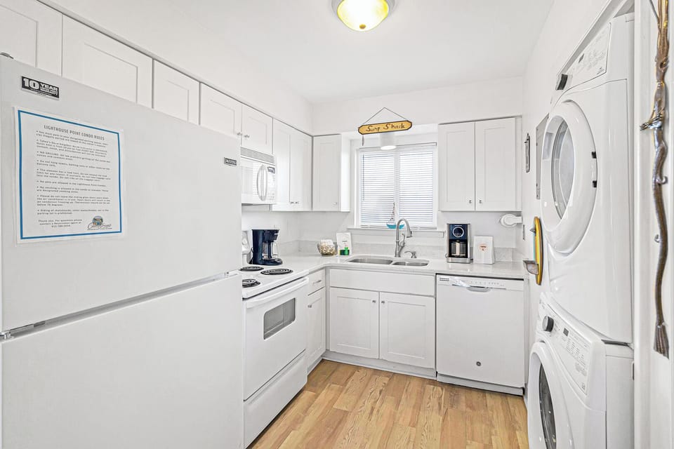 Kitchen with washer and dryer