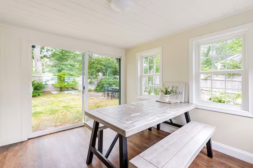 Sunny dining nook with backyard views and easy outdoor access
