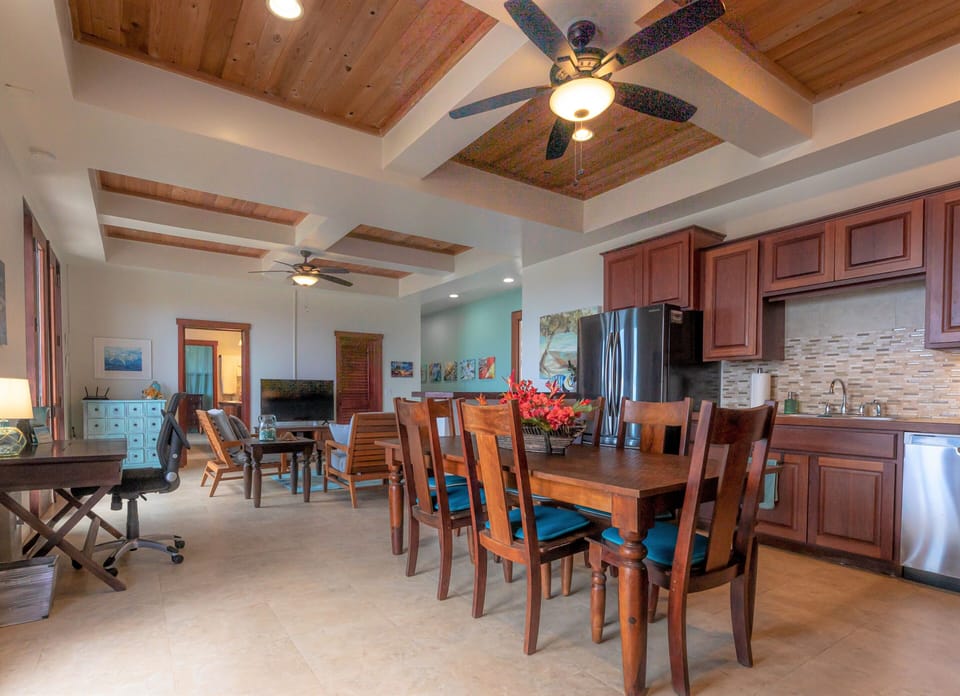Open concept with several doors opening to the view. 