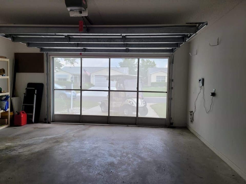 View from inside the garage with the actual garage door open, but the screen is closed.