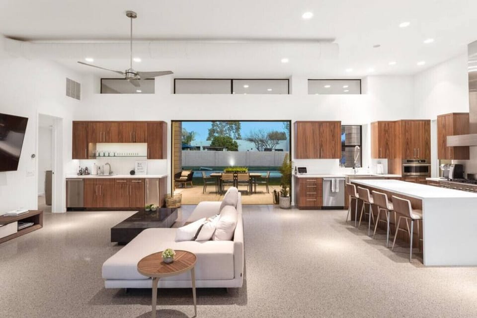 Kick back in this bright open-concept home with a full kitchen, comfy seating, and views of the pool.
