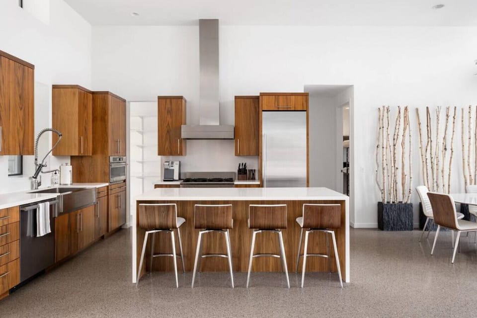 Enjoy drinks or casual meals at the stylish kitchen bar with modern touches and plenty of space to gather.