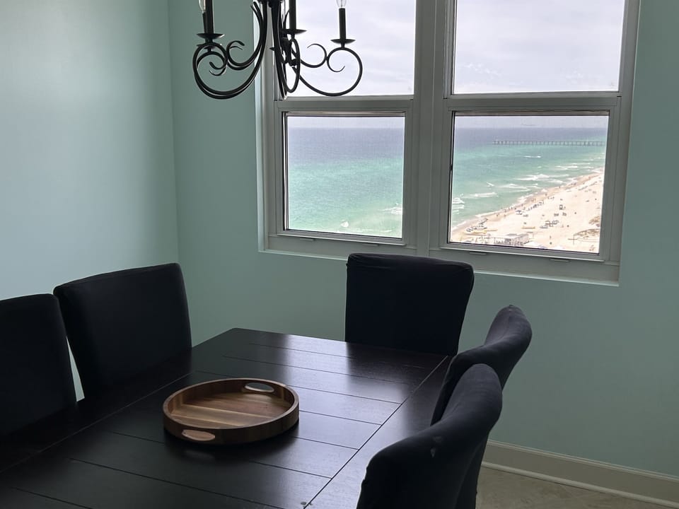 Savor morning coffee or evening meals at your dining table while gazing out at pristine turquoise waters and sandy shores stretching endlessly before you.