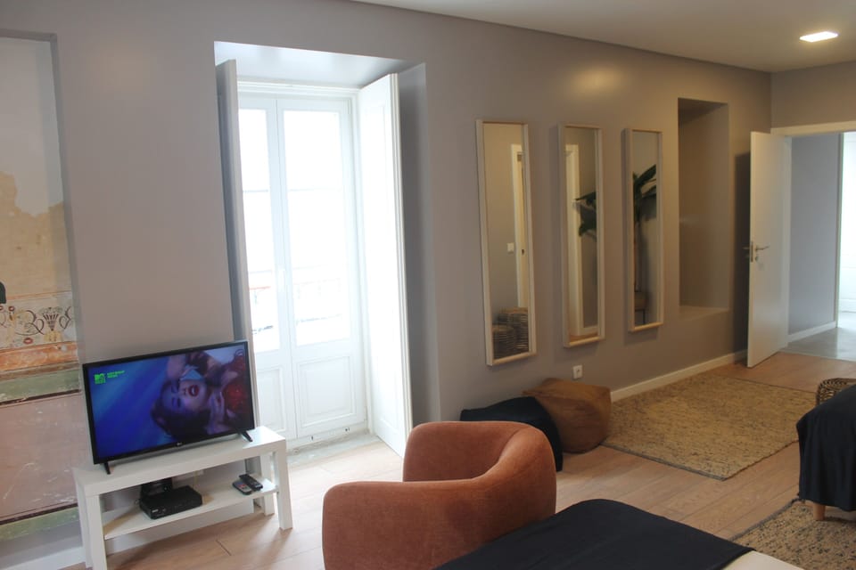 Family Apartment, 1 Bedroom | Living area | 50-cm flat-screen TV with cable channels