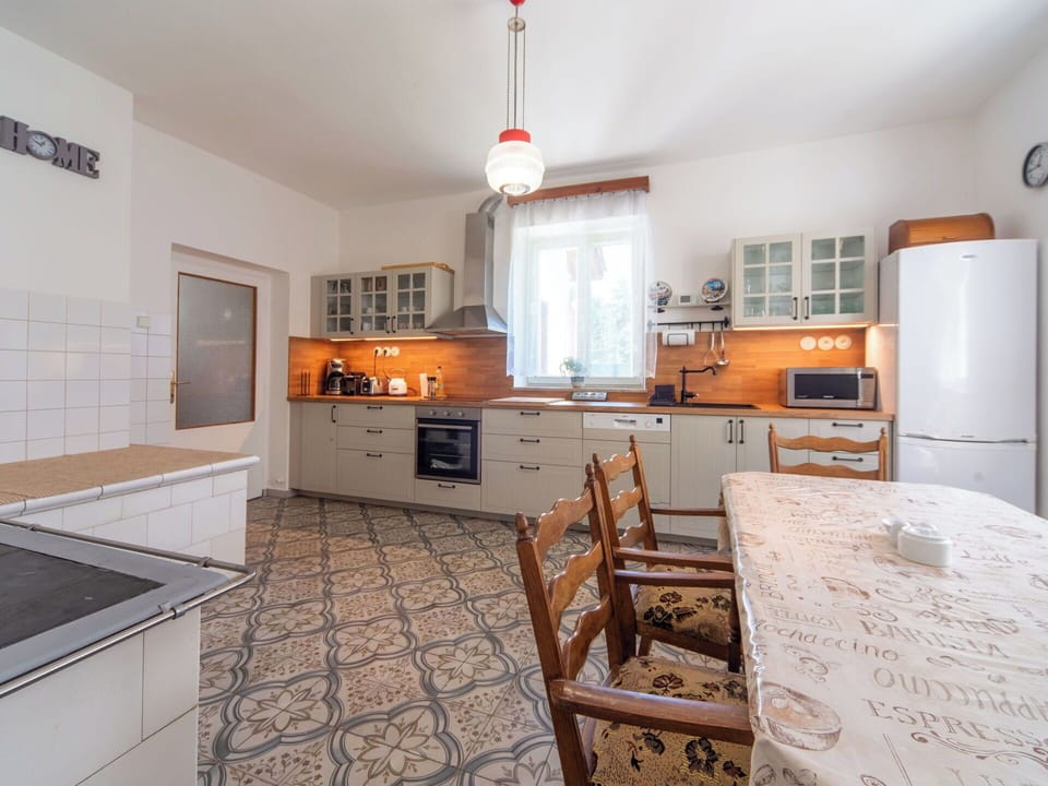 Flooring, Kitchen, Interior Design, Furniture, Cabinetry, Countertop, Floor, Ceiling, Room, Lighting
