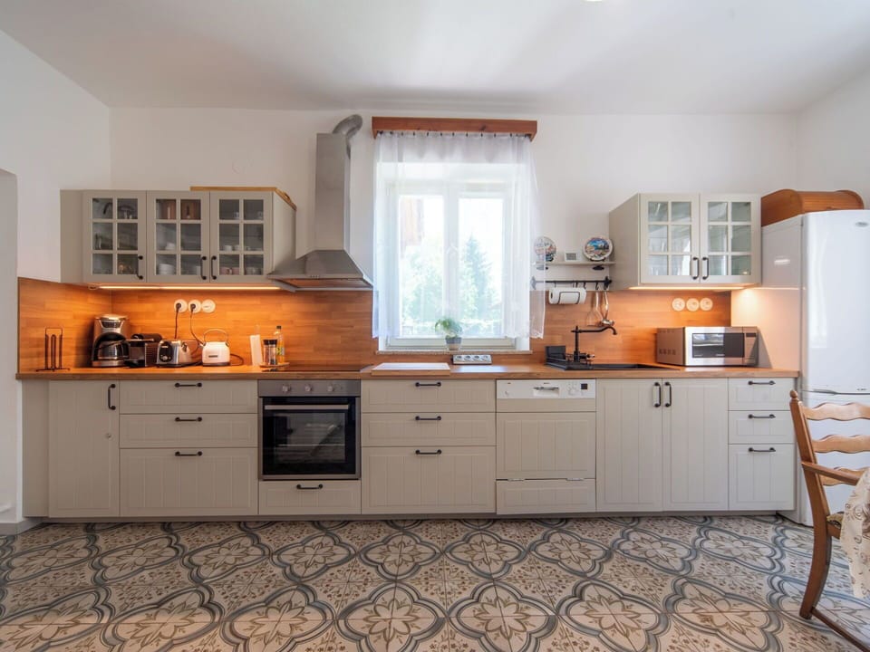 Kitchen, Kitchen Appliance, Cabinetry, Countertop, Furniture, Major Appliance, Interior Design, Flooring, Drawer, Wood