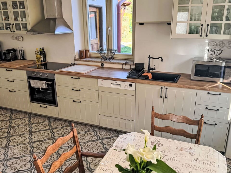 Kitchen, Cabinetry, Flooring, Countertop, Wood, Kitchen Appliance, Furniture, Drawer, Interior Design, Major Appliance