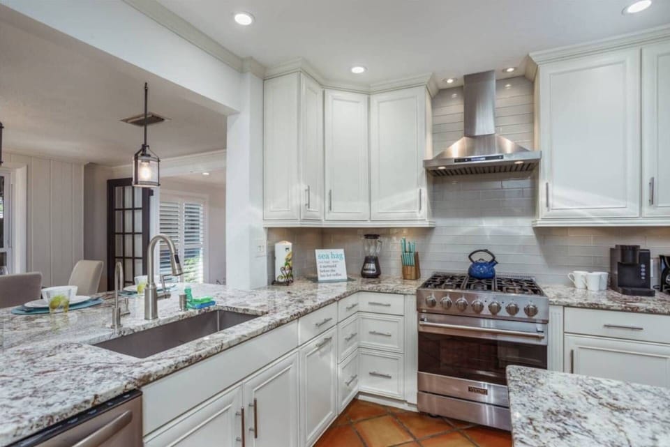 Beautiful, quality built kitchen with Viking appliances and solid stone counters & island