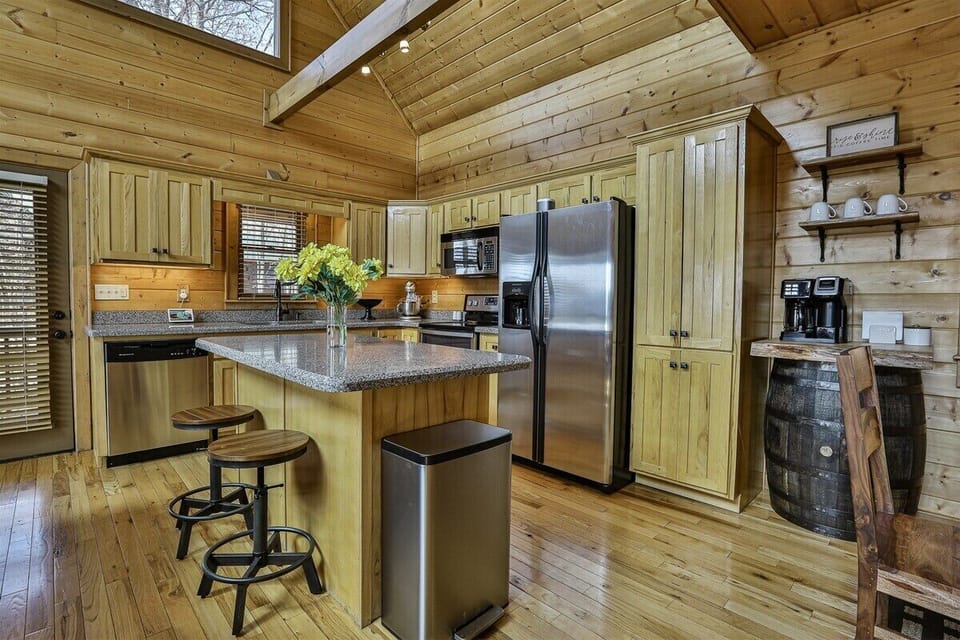 Open kitchen with breakfast bar seating for two