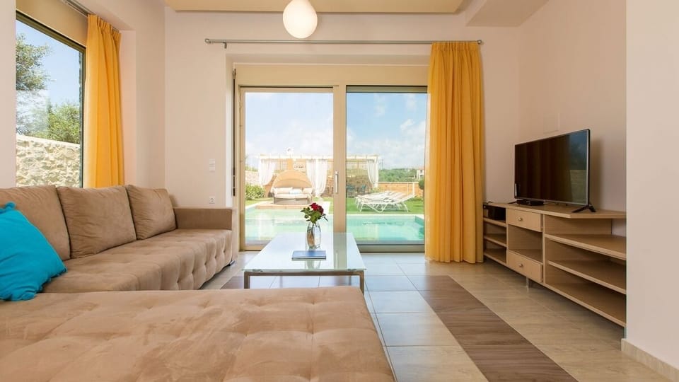 Open planned bright living room with TV