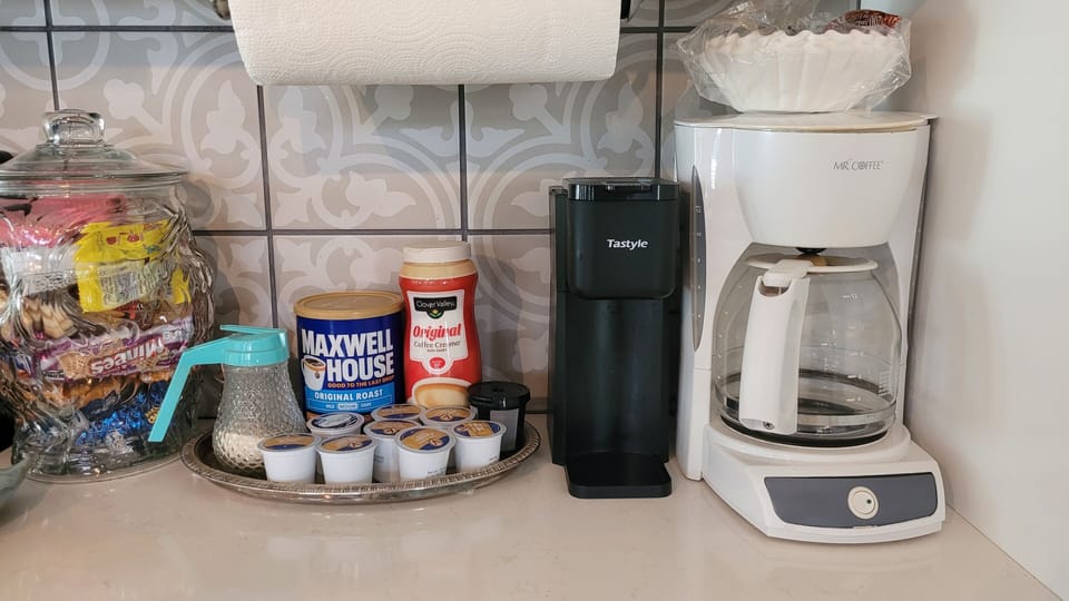 2 coffee makers, coffee, creamer and sugar provided.
