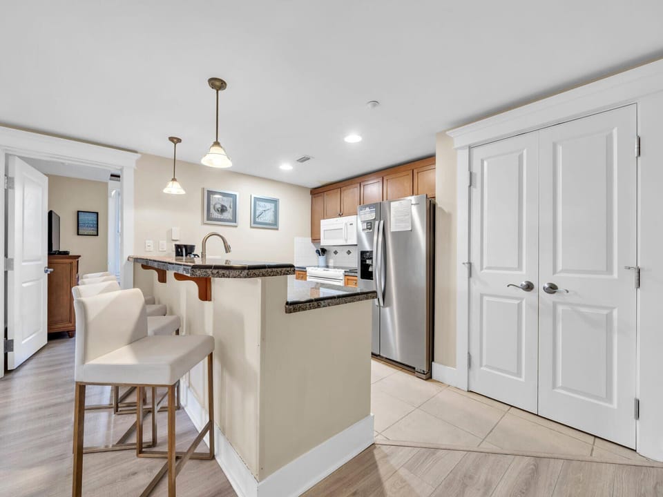 Washer and Dryer Behind Doors In Kitchen