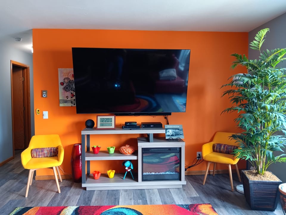 70' inch TV with electric fireplace. 