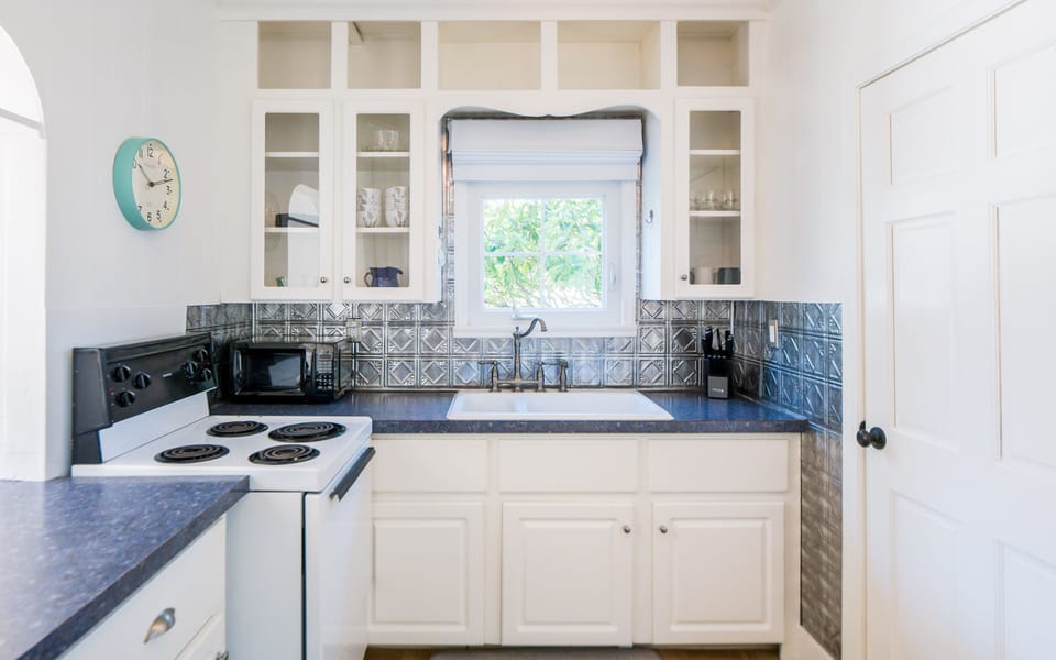 Kitchen with microwave, toaster, coffee maker and electric tea kettle