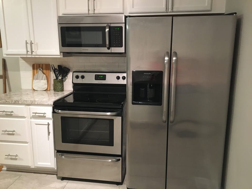 Refrigerator, oven, microwave and dishwasher provide all the home conveniences. 
