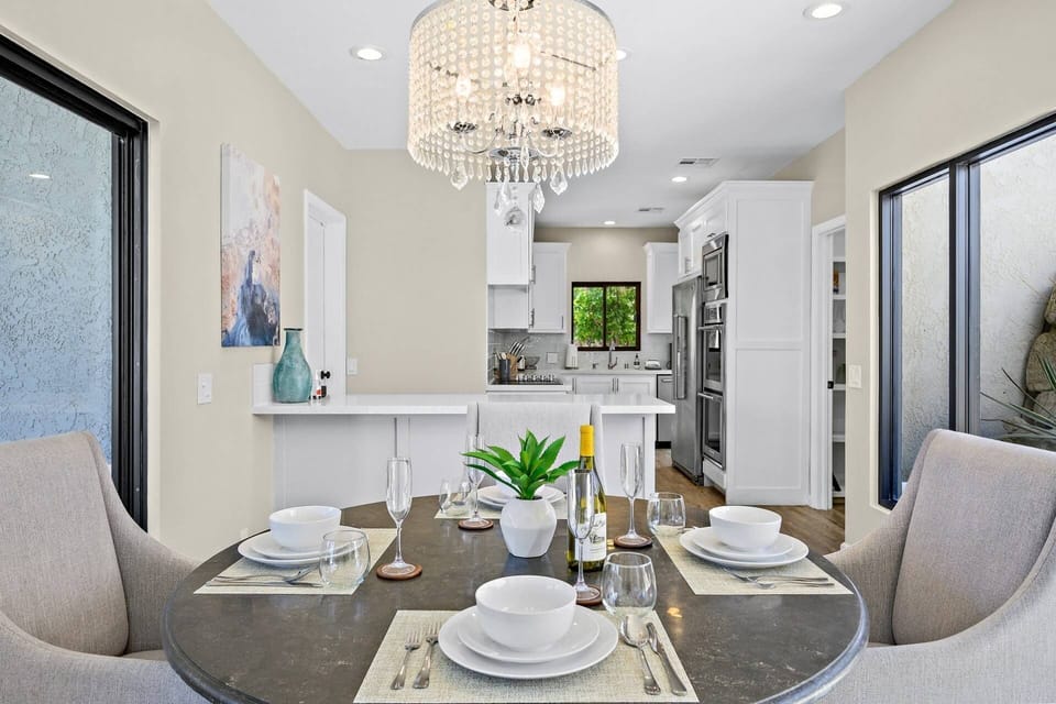 Spacious galley kitchen opens to dining table for 4