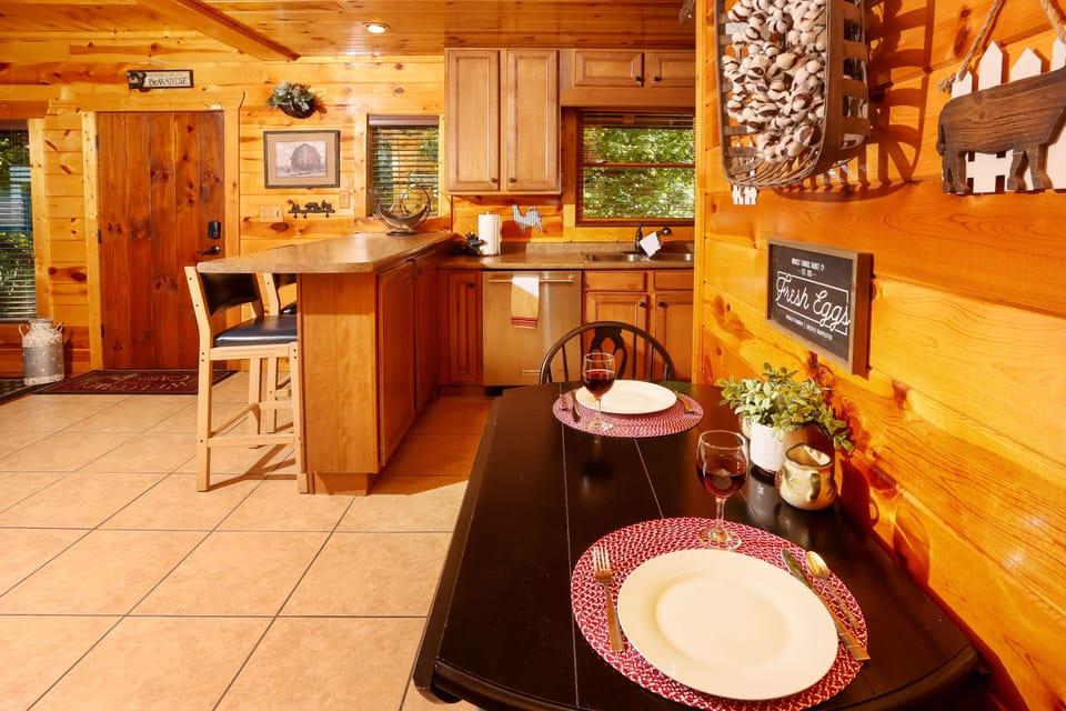 Kitchen view with dinette and bar stools.