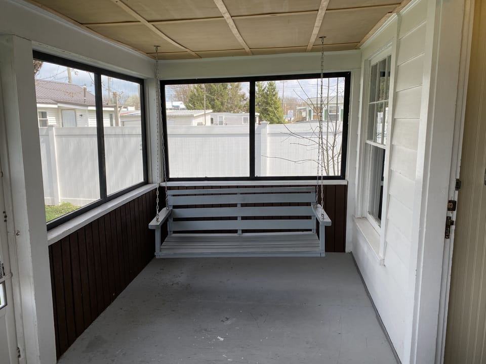Screened in porch with swing