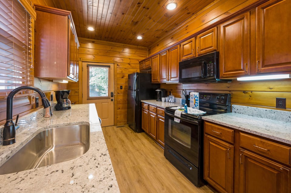 New dishwasher, sink, countertops and floors in this remodeled kitchen!