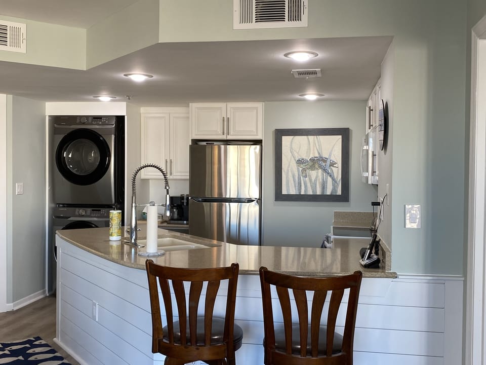 Kitchen with full size washer and dryer