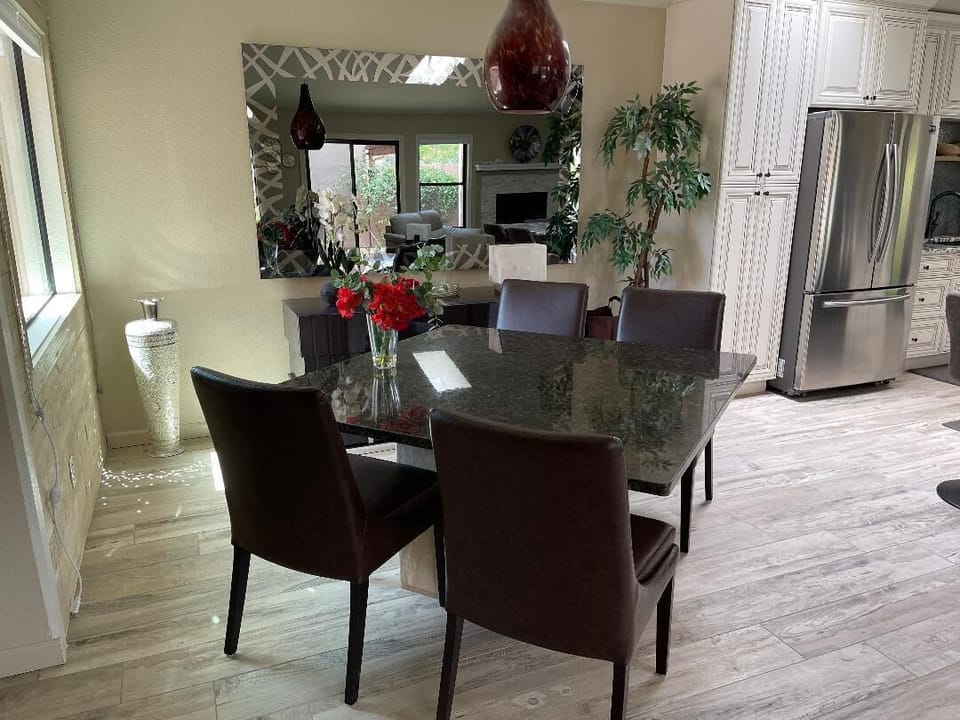 Granite Dining room Table with leather chairs