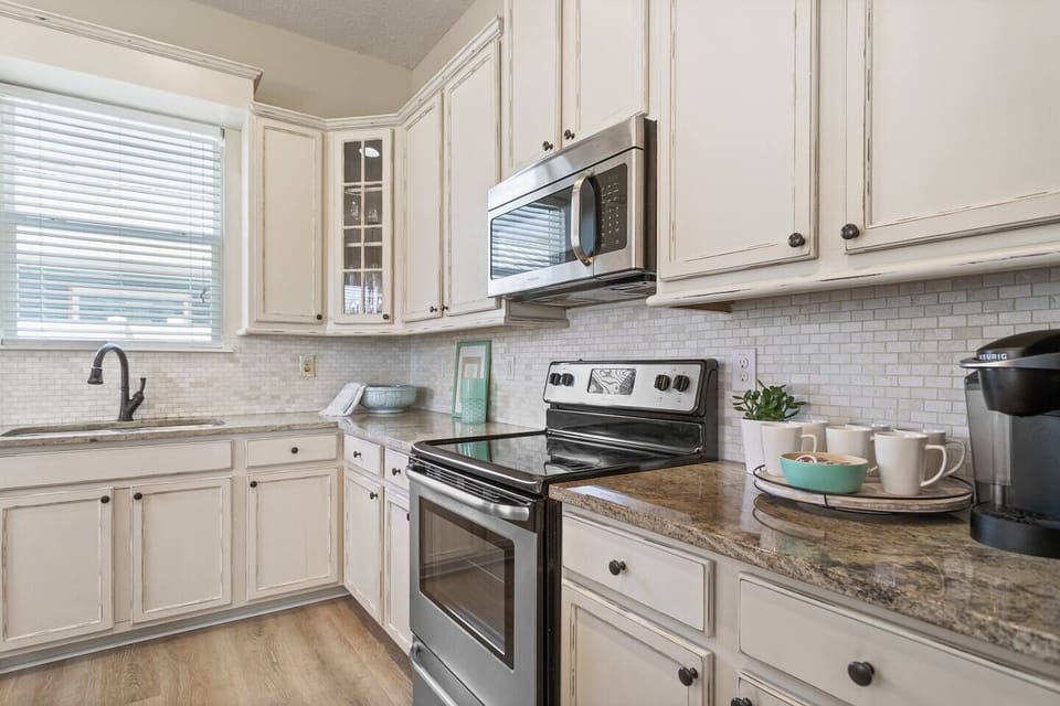 Additional kitchen view with coffee station