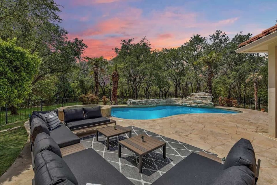 The backyard oasis at The Luxury Laguna Cliff Retreat features a pool and hot tub!