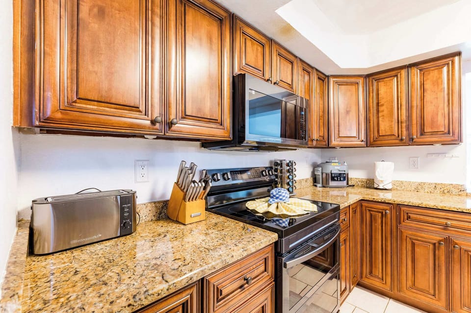 Cook with Ease! Plenty of granite countertop space and all the cookware you need. We've included a toaster and knife block for convenience.