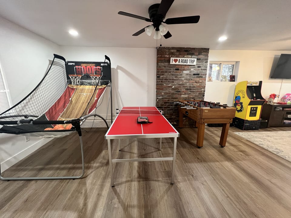 Game room with couch, TV and games