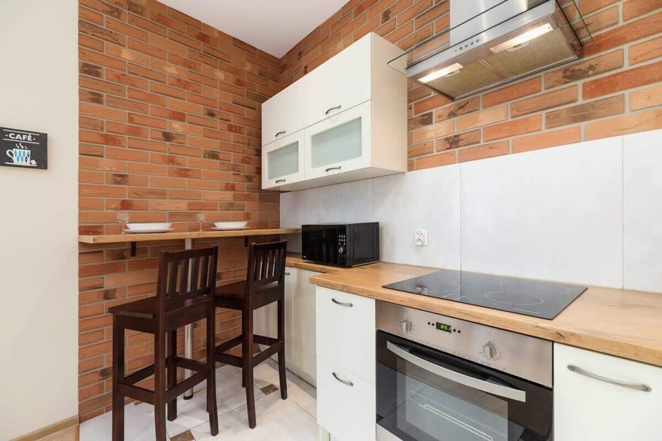 A wider view of the kitchen area, showcasing its bright and inviting design.

