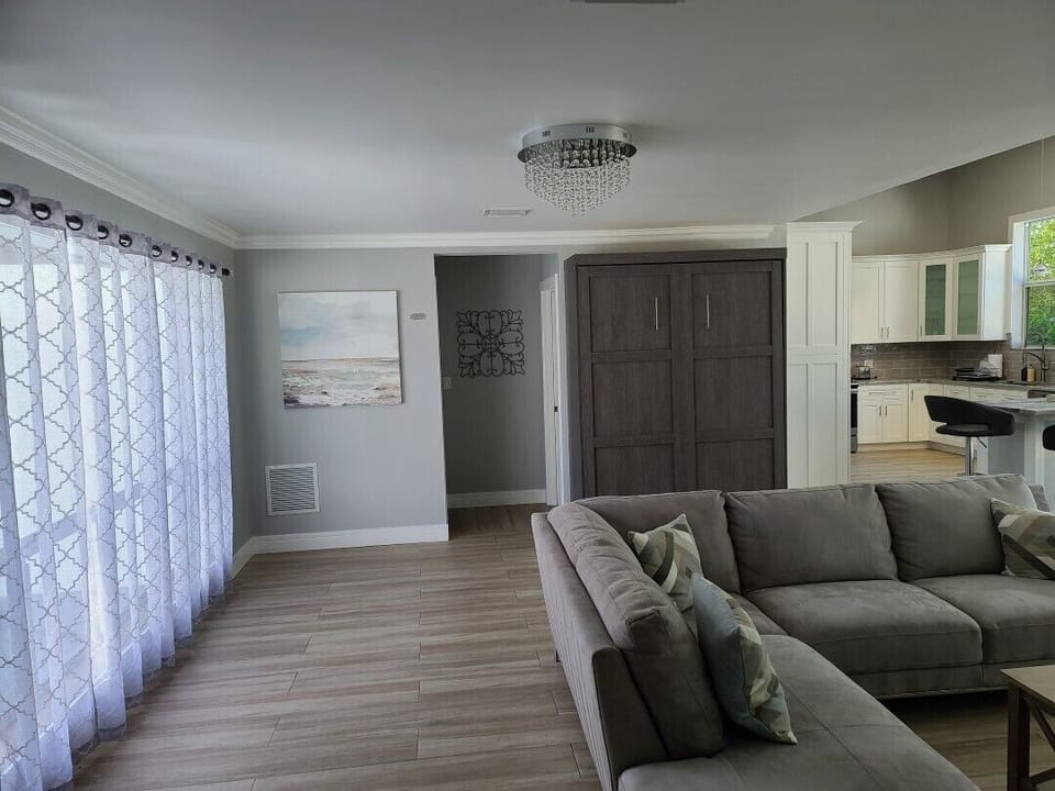 Front Door Looking Toward 3rd Bedroom with Bunk Beds and Separate Bath
