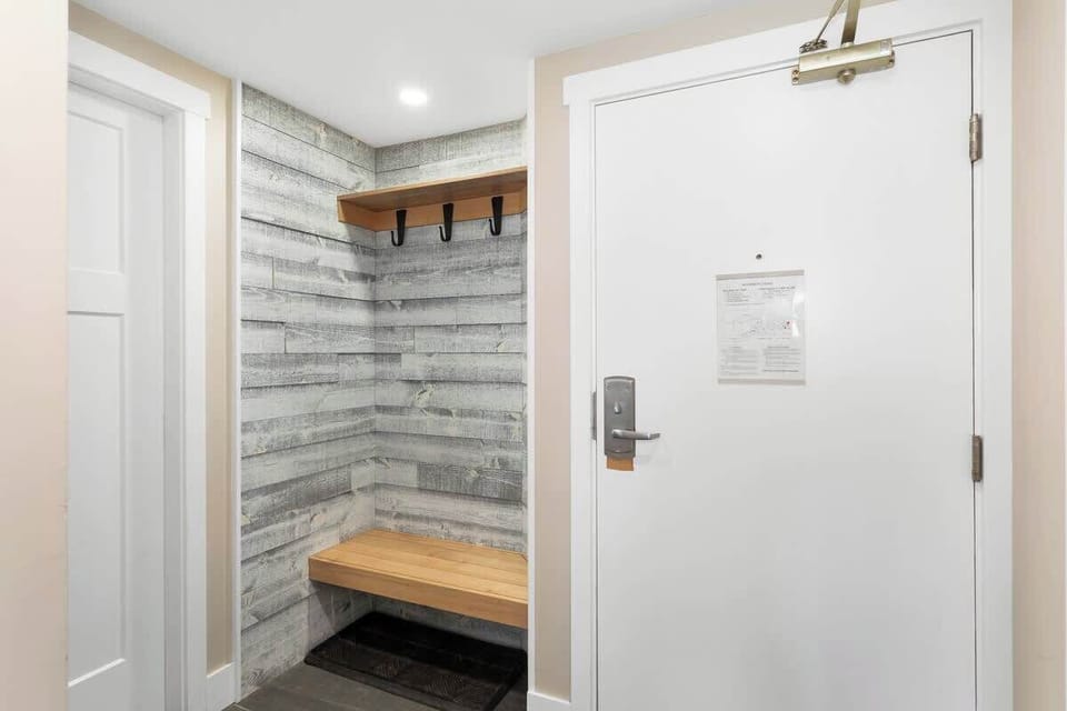 Entry with bench seating and coat hooks