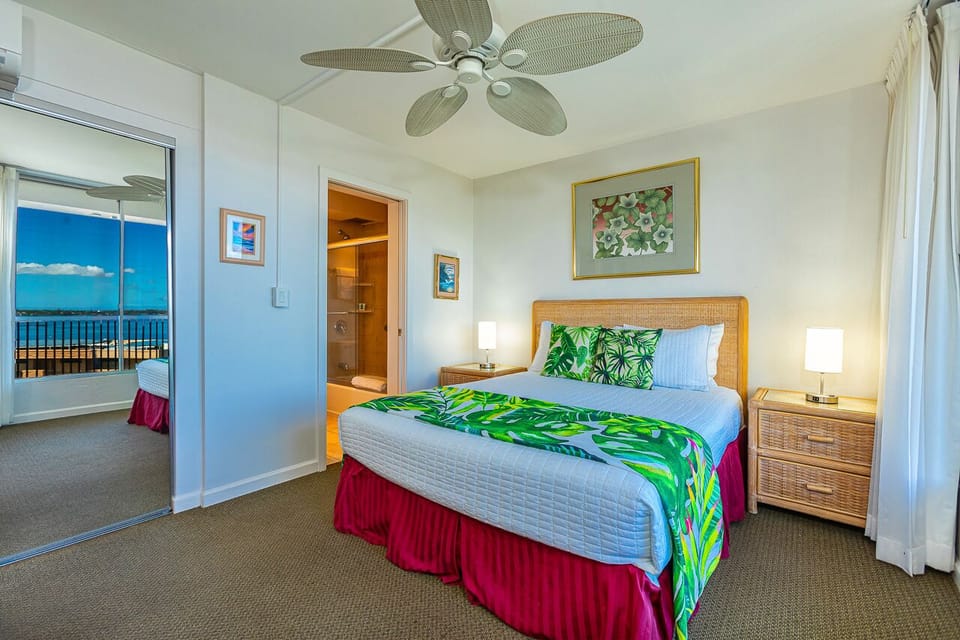 Studio guest bedroom features a comfortable queen bed. 