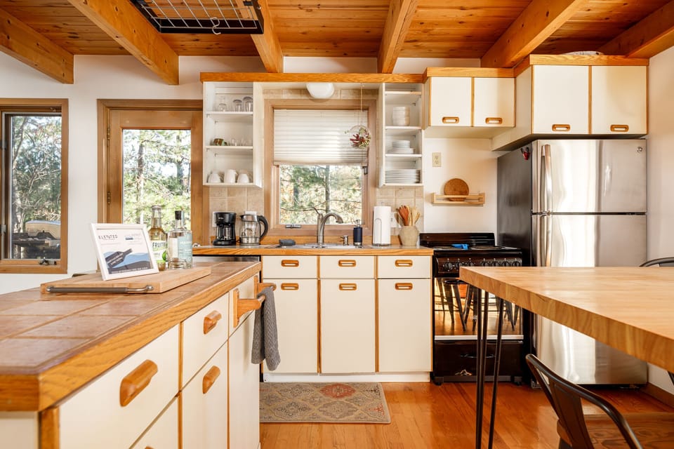 Well-equipped kitchen w/ ample counter space & cozy breakfast bar seating