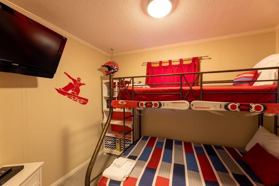 Third Bedroom: Twin over Full bunk bed, 32” TV, smart bluray, tons of DVDs and board games, bean bag chair. Great entertainment area for kids!