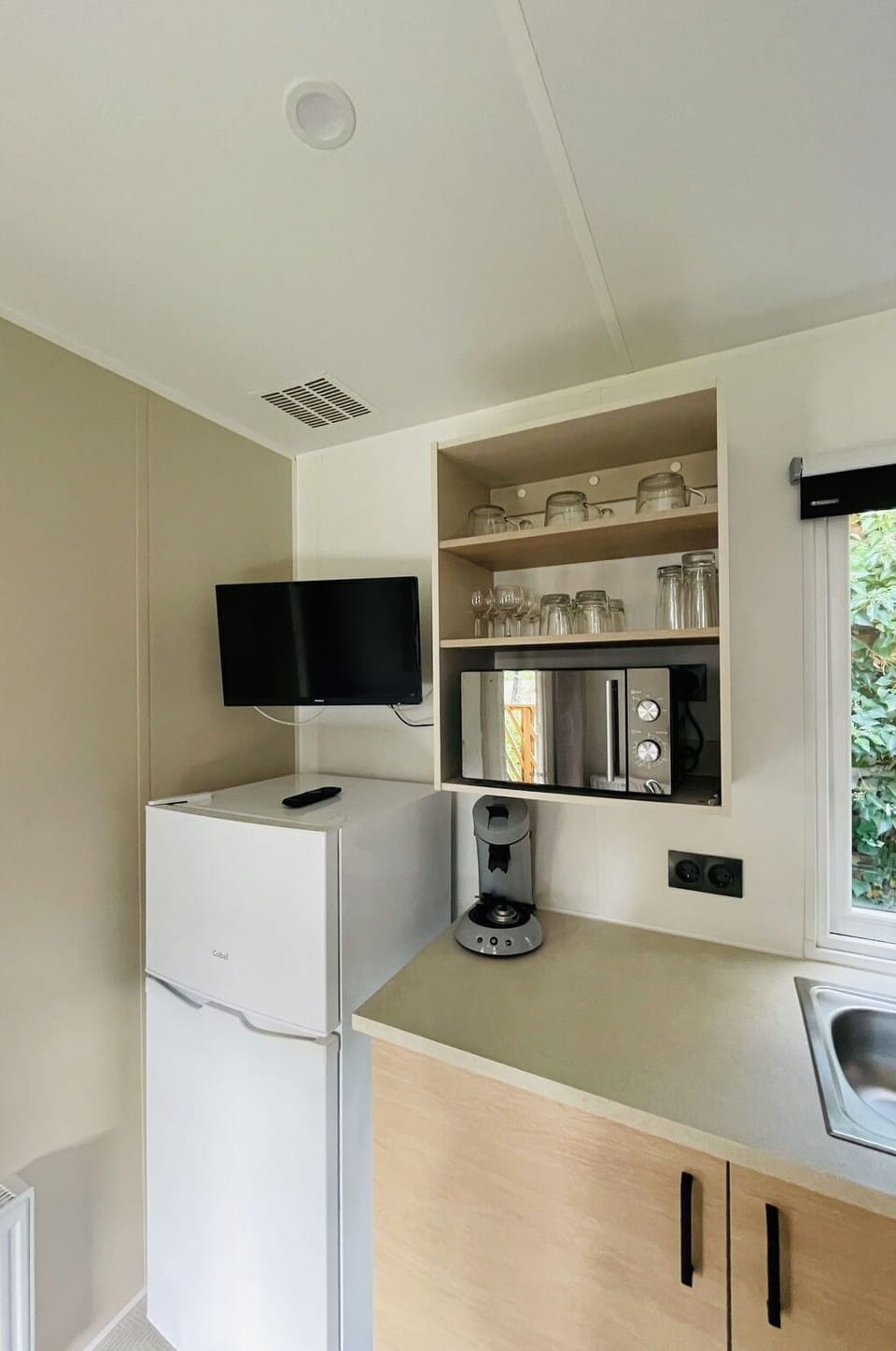 Interior Design, Flooring, Kitchen Appliance, Floor, Furniture, Room, Countertop, Ceiling, Lighting, Major Appliance