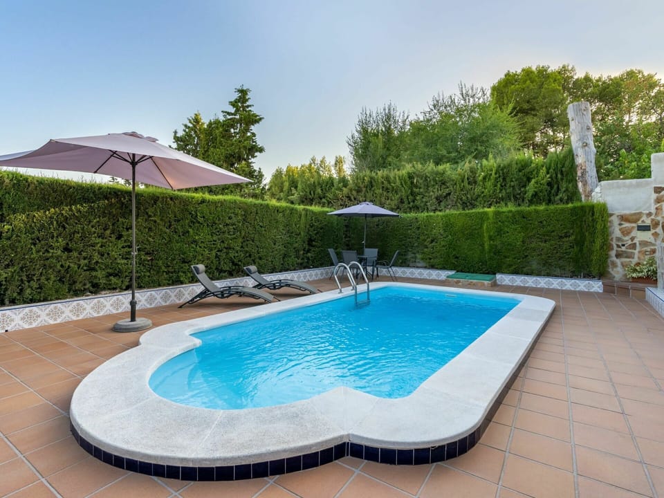Water, Plant, Sky, Property, Swimming Pool, Azure, Tree, Outdoor Furniture, Shade, Building