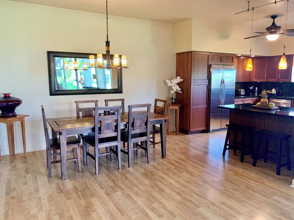 Beautiful sold wood dining table off kitchen.