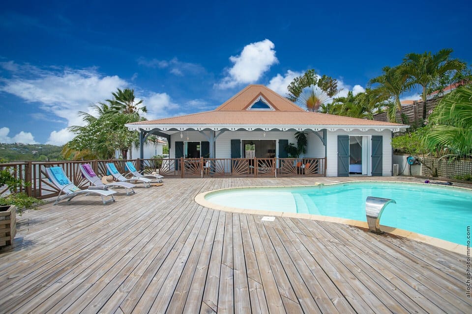 The Papaya villa has a huge outdoor living space, the covered terrace that serves as a dining room and its deck where the pool rests all overlooking the Caribbean Sea.
