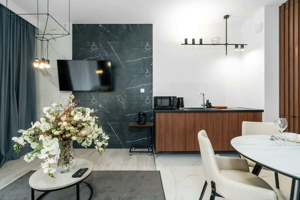 Contemporary kitchen with wooden finishes and sleek, modern appliances.