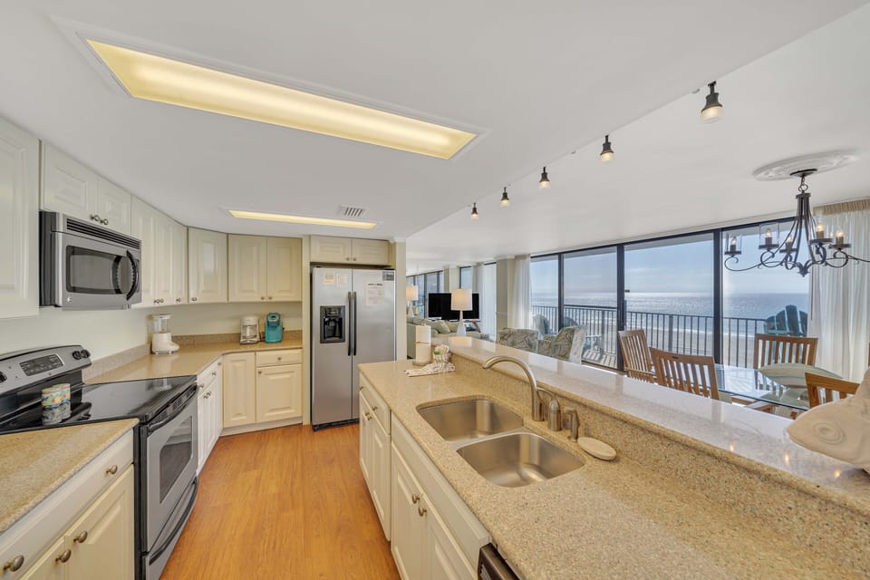 The kitchen features updated countertops & cabinets, stainless-steel appliances, and has everything you need to prepare meals for family & friends.
