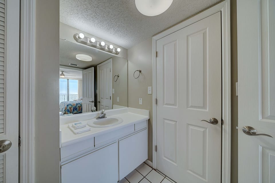 The ensuite master bathroom has a separate dressing area.