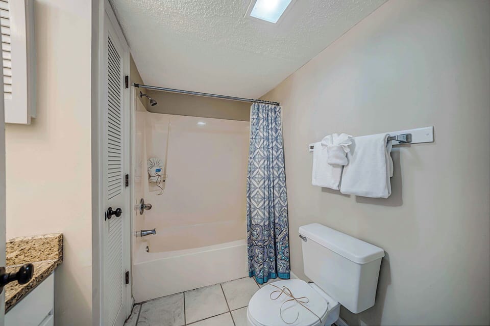 This second full bathroom also features granite countertops.