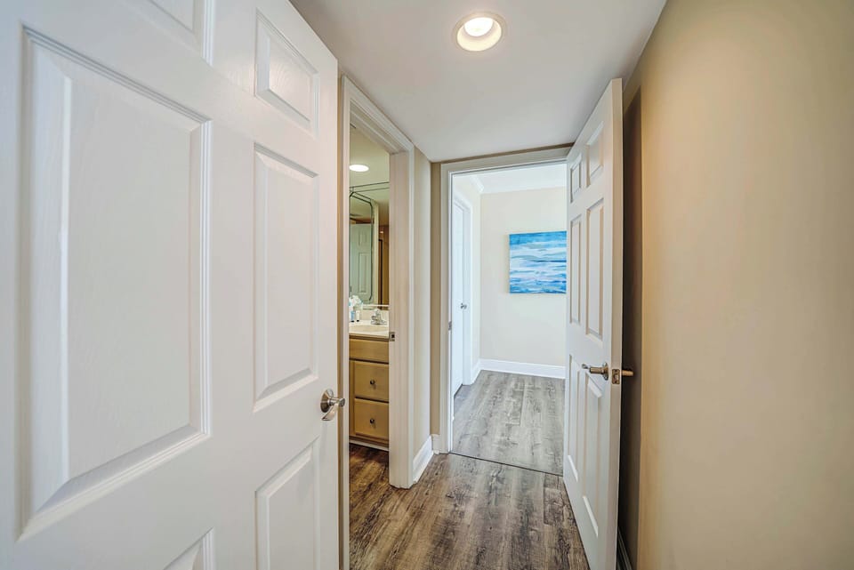 The second full bathroom with walk-in shower can be accessed off the hallway, just outside the second bedroom.