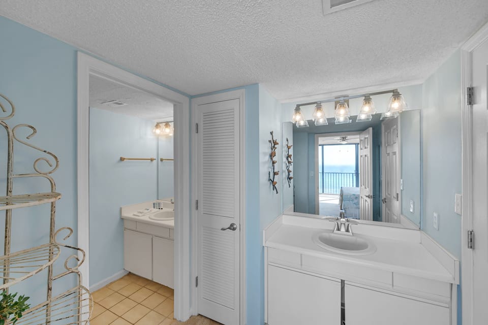 The ensuite bathroom has a tub/shower combo and separate dressing area.