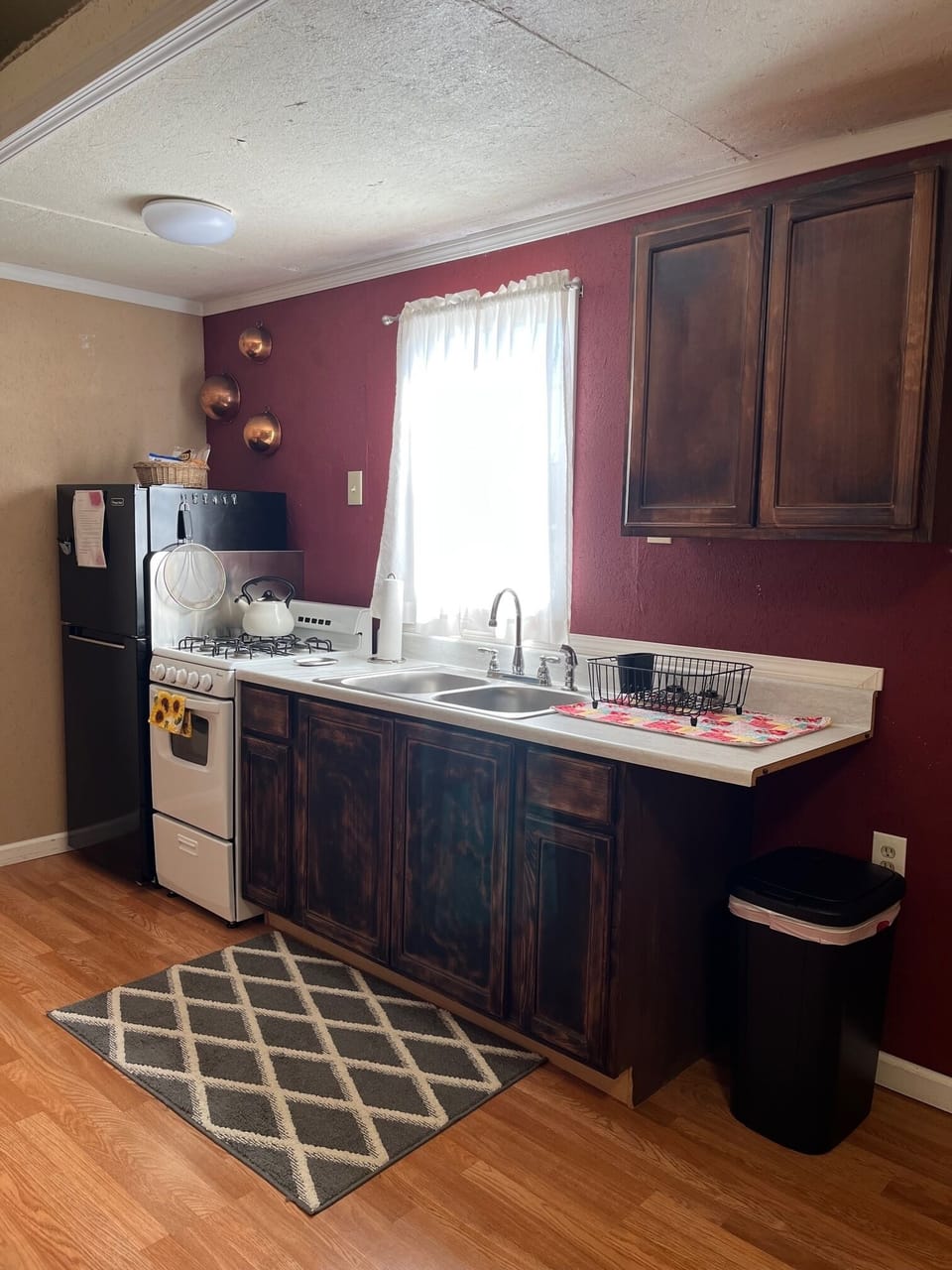 Kitchen area - refrigerator, stove/oven, sinks