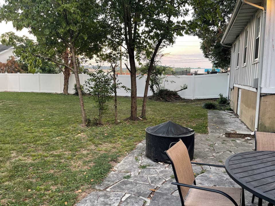 Fully fenced in Outside patio area with a privacy fence on all sides