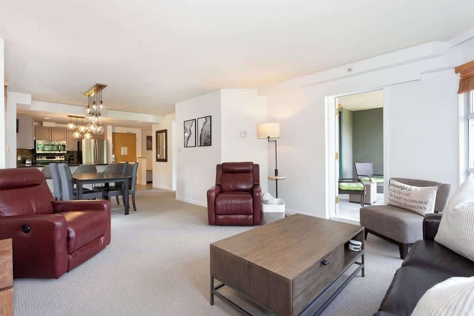 - Spacious living and dining area ideal for cozy gatherings and meals  
- Neutral décor and natural light highlight the inviting modern design  
- Relax, dine, and connect in this open-concept mountain getaway  