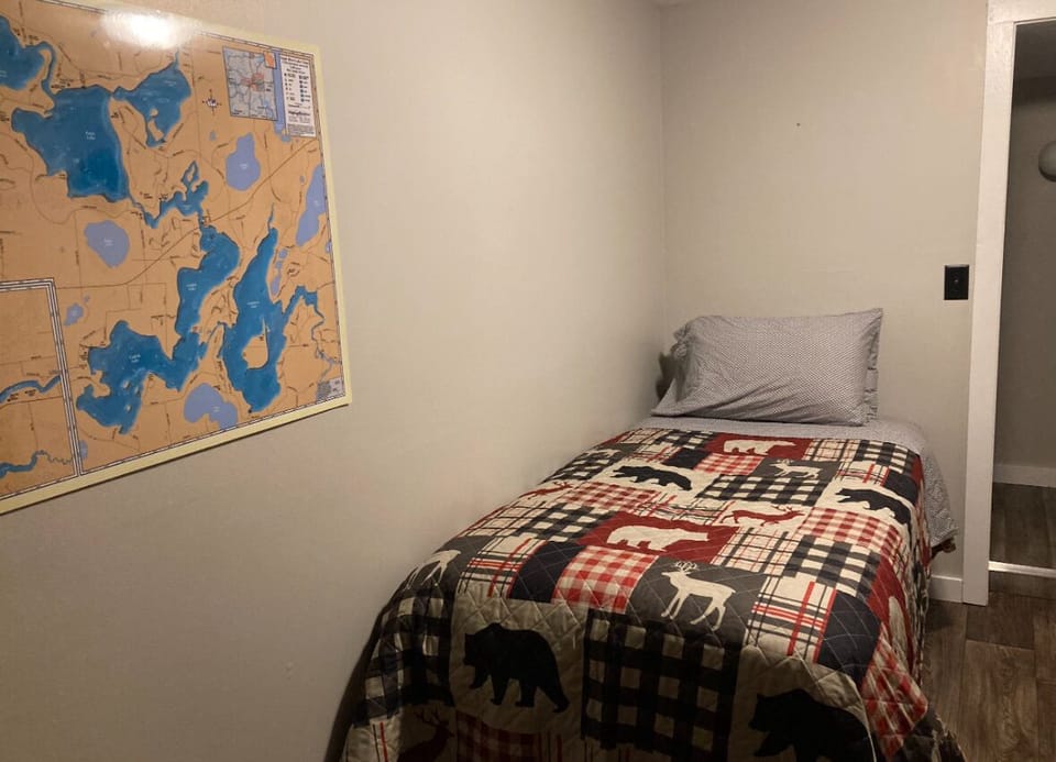 Twin bed is off of the living room as you enter the cottage. 